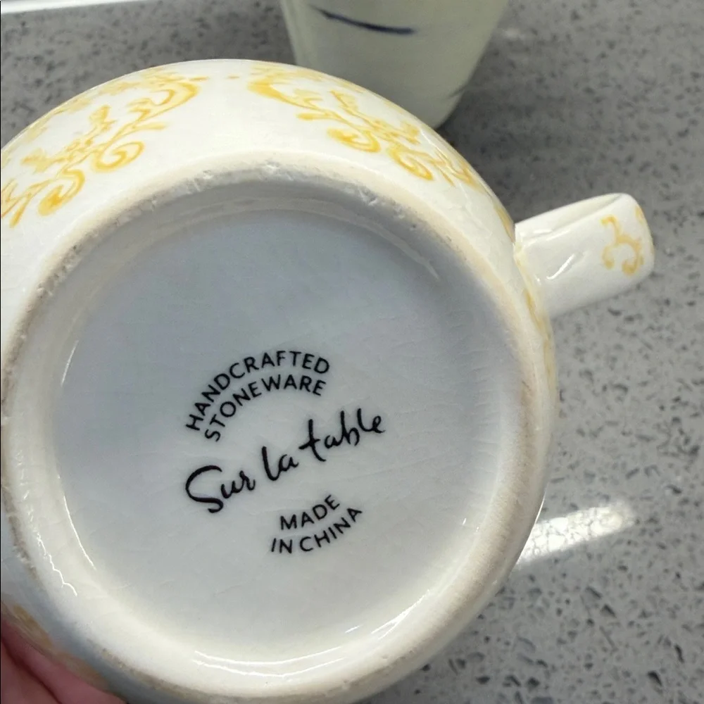 Sur la Table White Ceramic Mug with Yellow Filigree Pattern